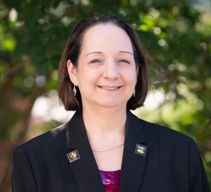 Portrait photo of Dr. Jeanne Van Briesen from the shoulders up.